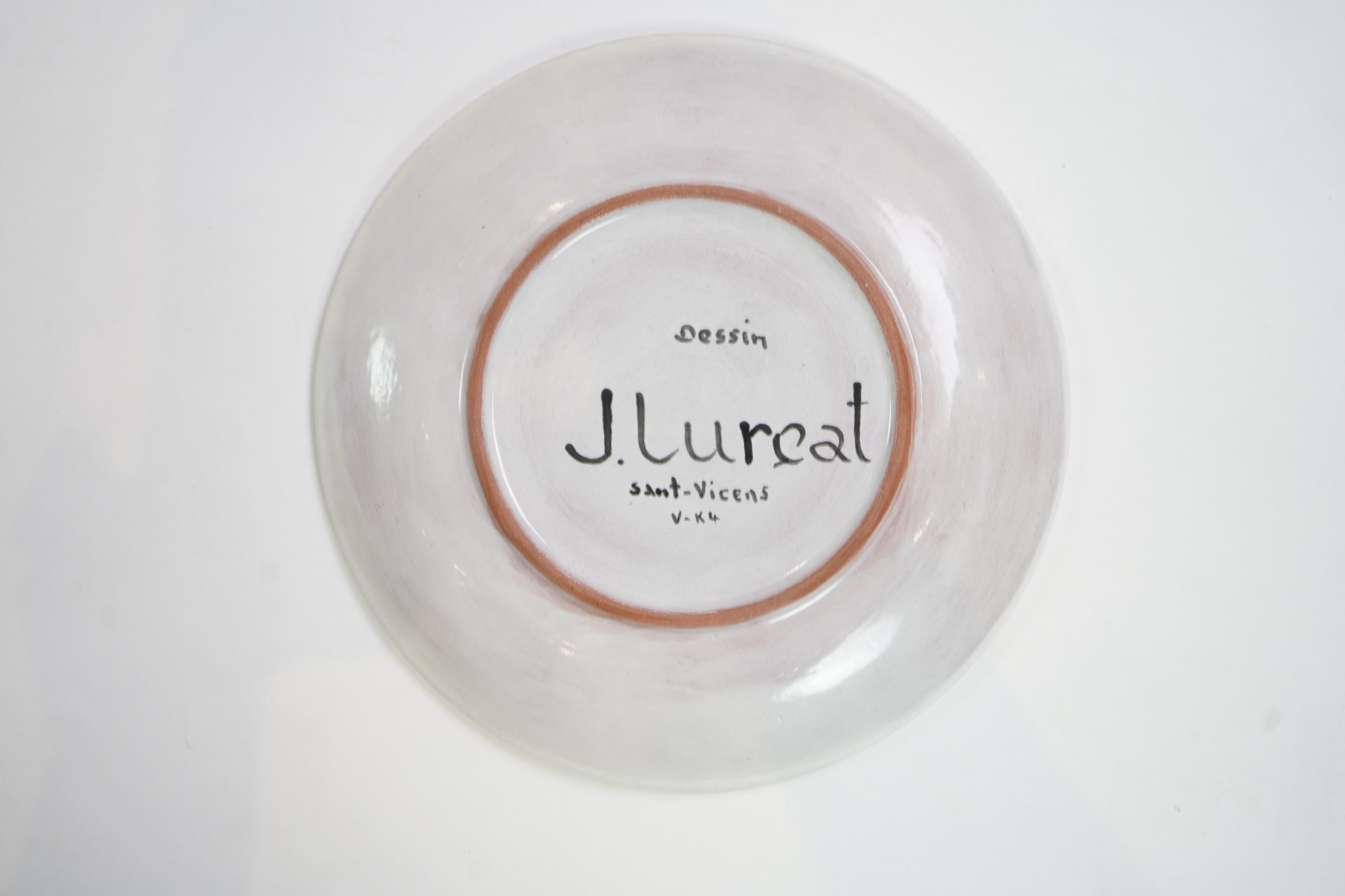Jean Lurçat (1892-1966): A white glazed earthenware plate, decorated with a central stylised cockerel